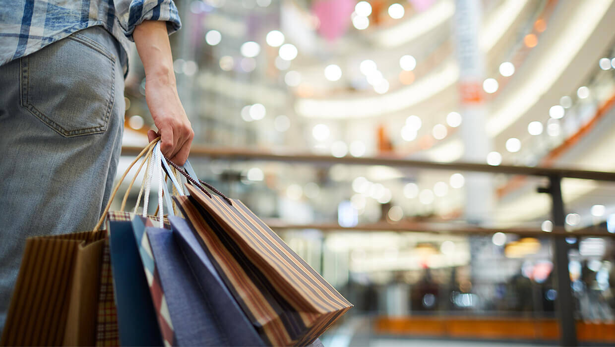 Markets-Retail-and-Restaurants-Male-with-Shopping-Bags